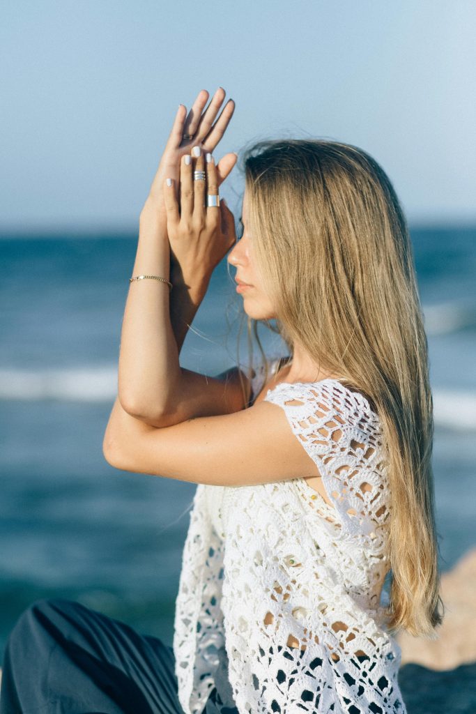 Girl with crochet sweater at beach